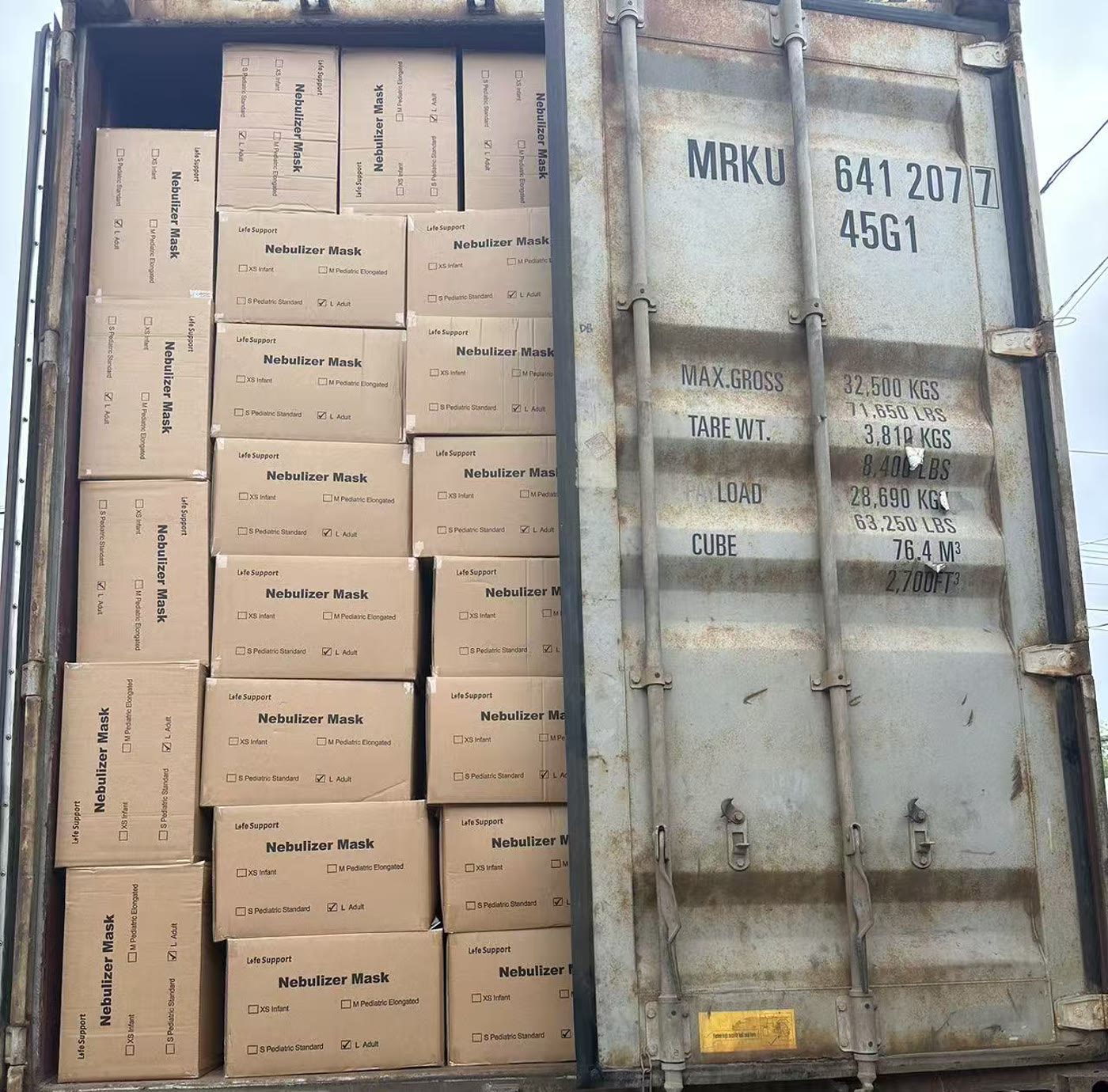 Container one: cartons of medical supply products loaded up to the door